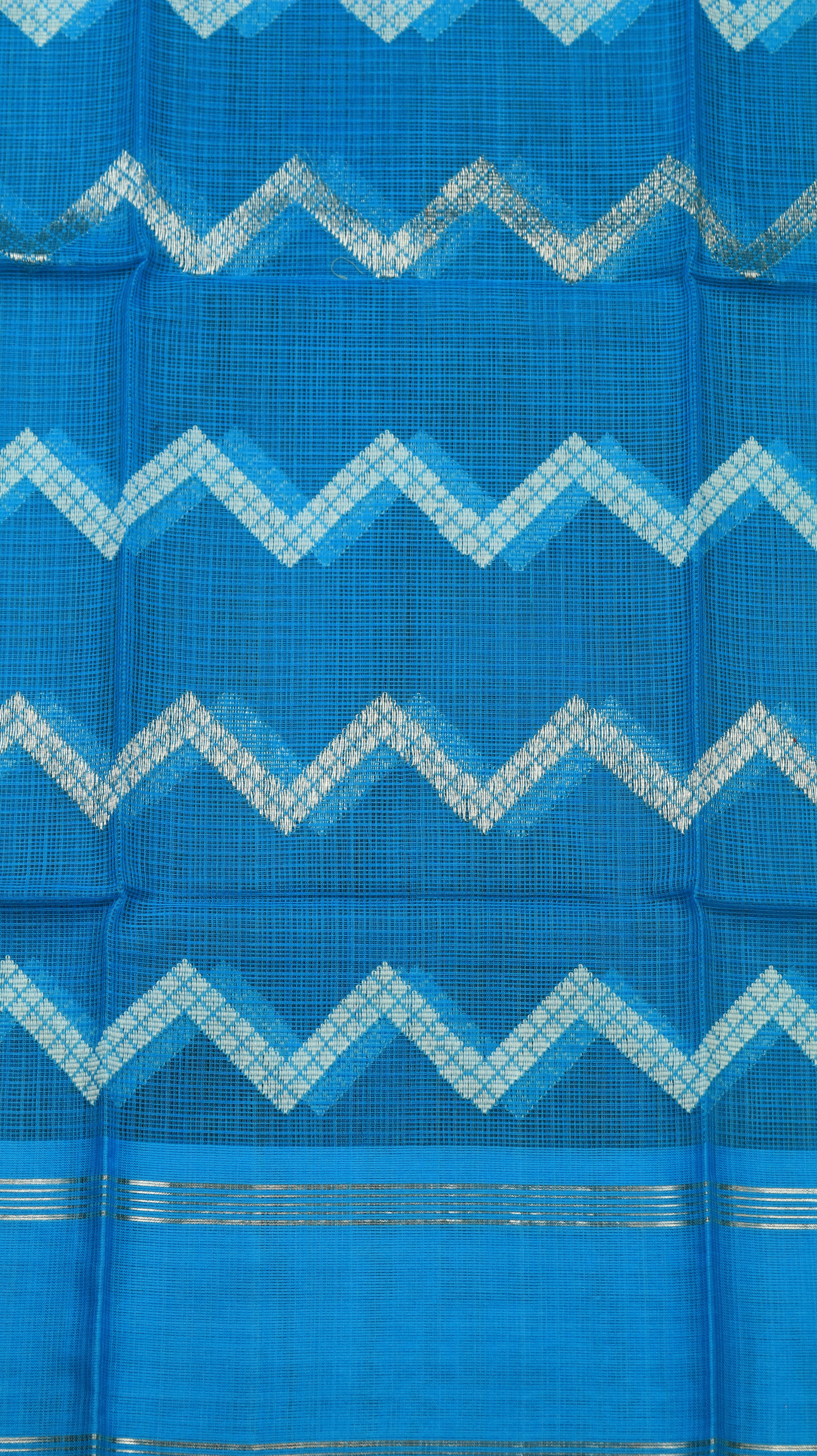 Blue fabric with white zigzag pattern